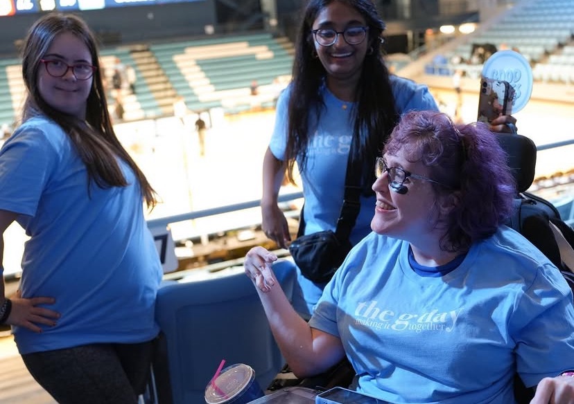 G Day members discussing the volleyball game they watched